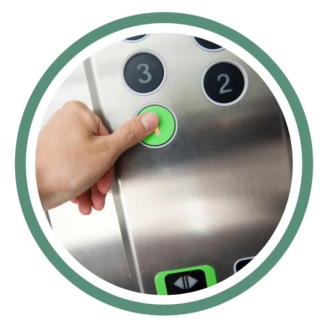 A person pressing the button on an elevator.